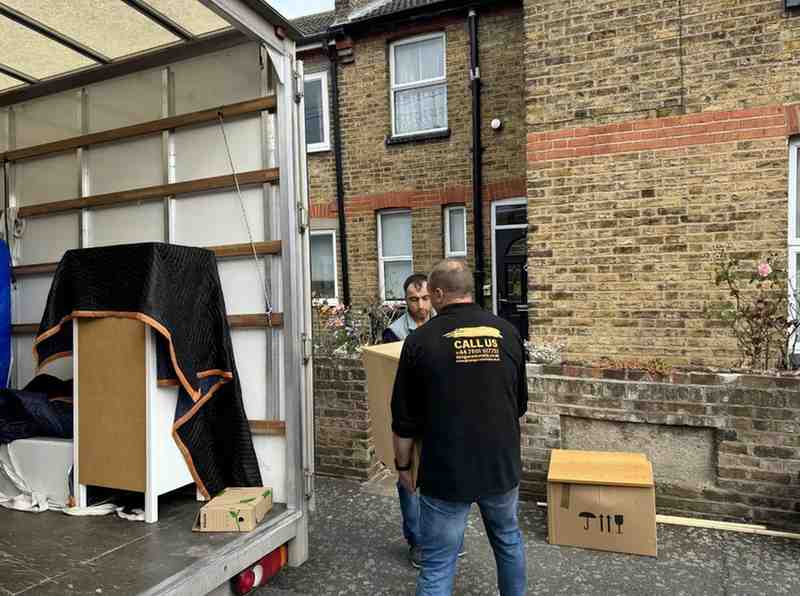 2 people are helping clients for flat removals in London